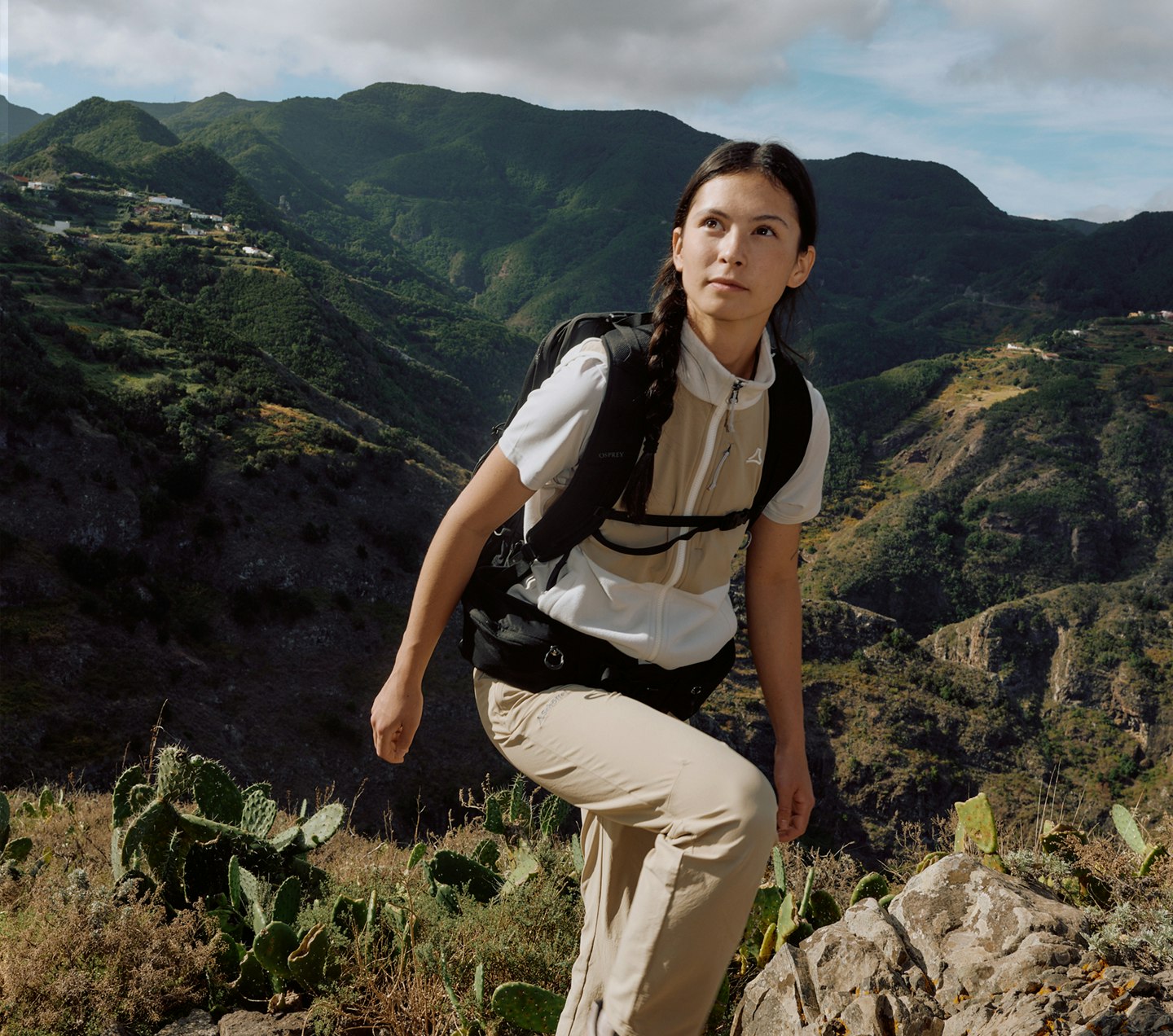 A woman hiking in the mountains.