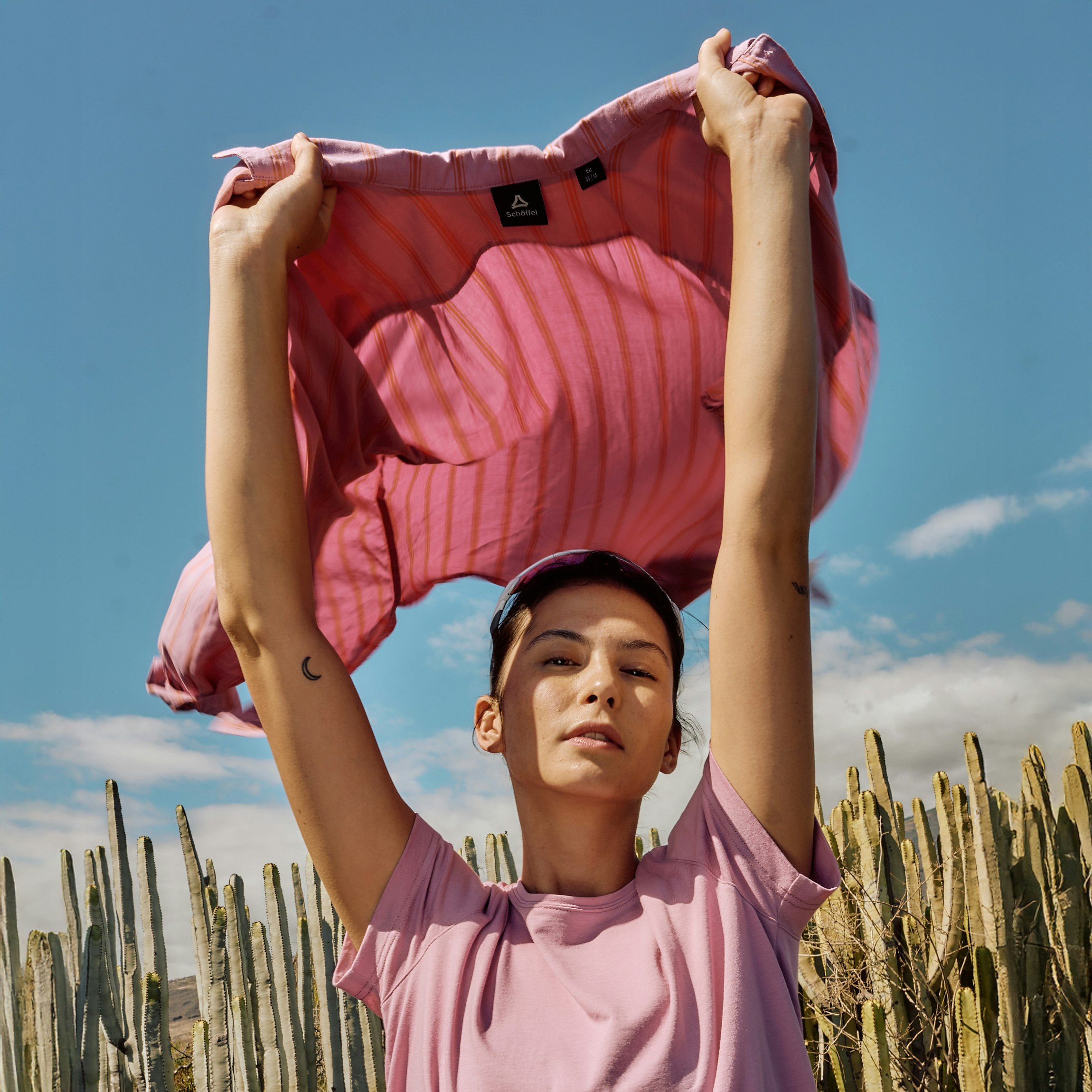 A woman wearing an outleisure shirt and blouse.