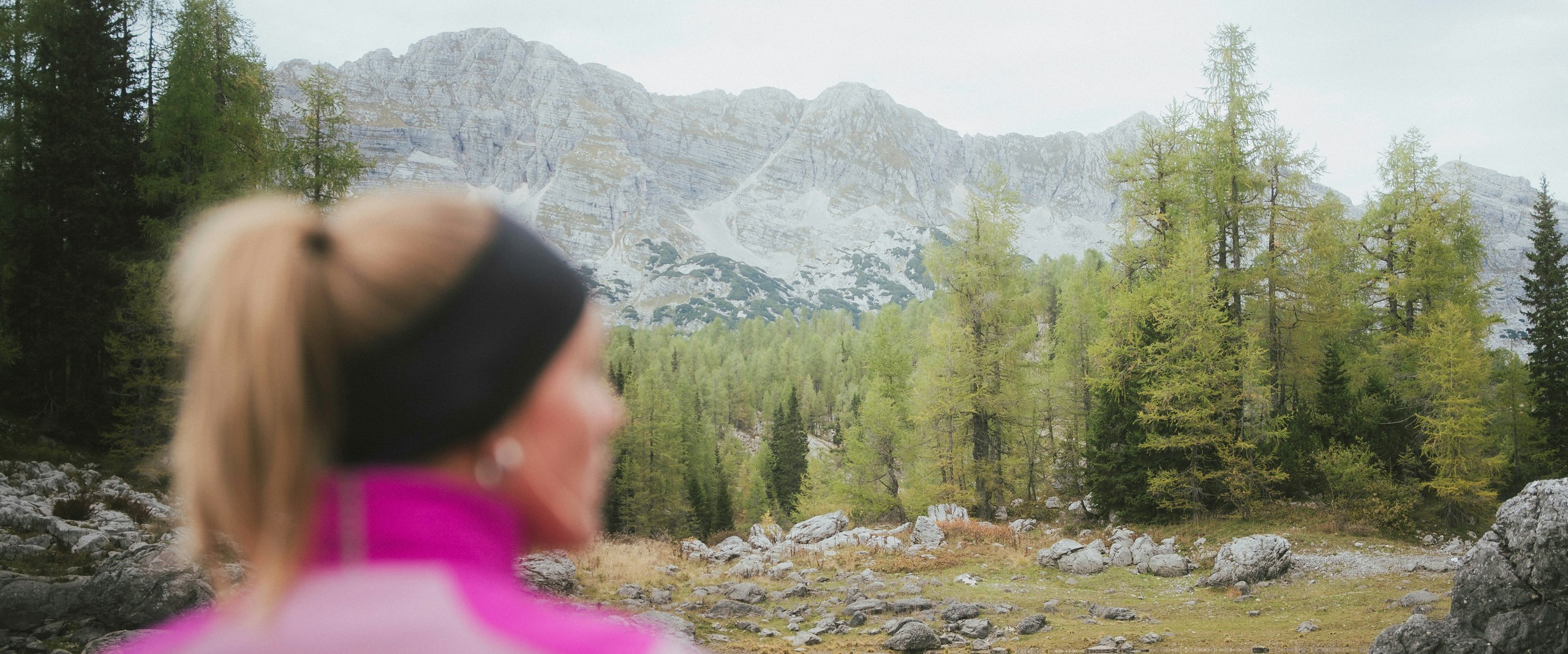 A woman enjoys the view of the mountains.